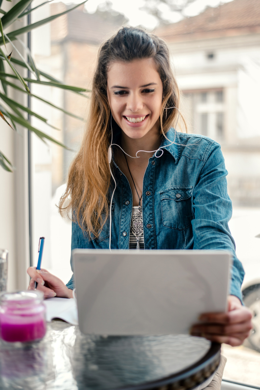 Young woman is watching a online course